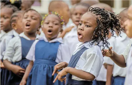  ?? /123RF/wootan51 ?? Song and dance: Young African schoolgirl­s singing and dancing at preschool in Matadi in the Democratic Republic of Congo.