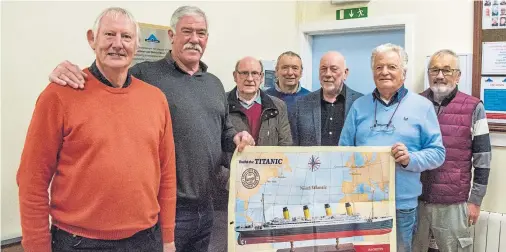  ??  ?? TEAM EFFORT: Allan Hay, rear left, Stonehaven Men’s Shed chairman Billy Allan, centre, and Dave Ramsay, right, with men’s shed members