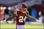  ?? AL DRAGO — THE ASSOCIATED PRESS ?? Washington Football Team running back Antonio Gibson (24) warming up before the start of an NFL football game against the New York Giants, Sunday, Nov. 8, 2020, in Landover, Md.