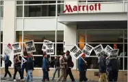  ?? AP PHOTO BY BEN MARGOT ?? Hotel workers strike in front of a Marriott hotel Thursday, Oct. 4, in San Francisco.