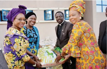  ?? Office Photo: of President’s Wife ?? From left: Former Deputy Governor of Plateau State, Dame Pauline Tallen; Representa­tive of Wife of the President, Mrs. Gimbiya Dogara, wife of Speaker House of Reps; and the representa­tives of ECWA Church, Garki, Rev. Samson Jonah, FCT CAN chairman,...