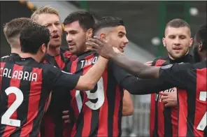  ?? (AFP) ?? AC Milan’s Italian defender Alessio Romagnoli (4th left) celebrates after opening the scoring during the Italian Serie A match vs Fiorentina at the San Siro stadium in Milan on Sunday.