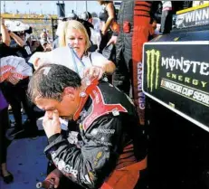  ?? Jonathan Ferrey / Getty Images ?? Ryan Newman gets cooled down with ice and water in victory lane after winning the Camping World 500 on Sunday at Phoenix Internatio­nal Raceway.