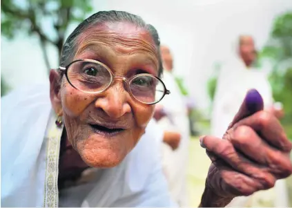  ?? EPA ?? An elderly woman’s ink-stained thumb shows she has cast her vote in the first phase of elections in the state of Assam yesterday.