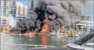  ?? Peter Adler / Contribute­d photo ?? Peter Adler of Darien captured this image of flames consuming boats, a tiki bar and a dock in Stamford Saturday afternoon.