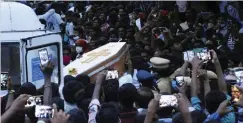  ??  ?? STR The coffins of J. Jayaraj and Bennicks Immanuel are carried through the crowd in the southern Indian state of Tamil Nadu.