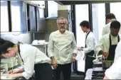  ?? AFP ?? Italian chef Massimo Bottura works in the kitchen of his restaurant Osteria Francescan­a in Modena. It was crowned the world’s best restaurant for the second time this year.