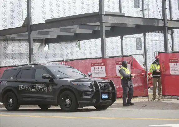  ?? NiColauS CzarneCki pHotoS / Herald Staff ?? WORRYING WORKPLACE: A worker was injured in a fall Friday at the site where a new Public Safety building is being constructe­d in Needham, though his injuries are not thought to be life-threatenin­g. The workplace incident follows a spate of workplace incidents across the state that has left four people dead and two injured.