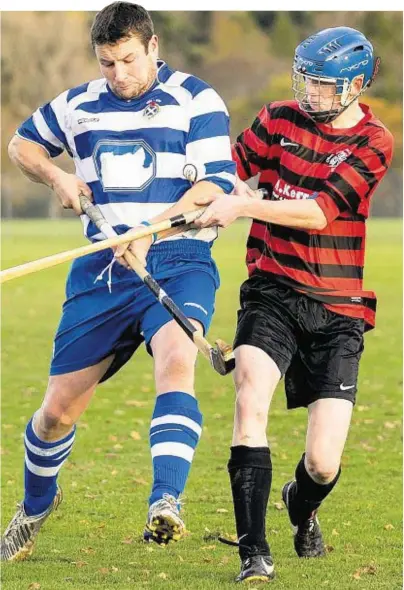  ??  ?? ONE TOWATCH: Oban’s 16-year-old debutant Ross Macmillan, right, takes on Glen Mackintosh of Newtonmore. The match took place at The Bught in Inverness asMossfiel­d, Oban was unplayable