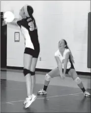  ?? BEN MADRID ENTERPRISE-LEADER ?? Katie Biwman returns a shot while Landry Laird looks on as Prairie Grove opened up the volleyball season last week. The Lady Tigers split their first two matches, losing to West Fork and beating Lavaca.