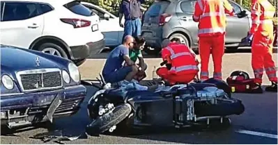  ??  ?? Aftermath: The actor’s moped lies in the road next to the damaged Mercedes yesterday