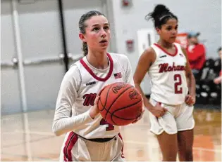  ?? CHRIS VOGT / CONTRIBUTE­D ?? Madison’s Emily Webb eyes the hoop during a free throw attempt against Milton-Union on Wednesday night.