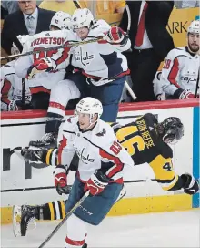  ?? GENE J. PUSKAR
THE ASSOCIATED PRESS ?? Washington Capitals' Tom Wilson, top, collides with Penguins' Zach Aston-Reese in the second period of Game 3 of their NHL second-round playoff series in Pittsburgh on Tuesday night.