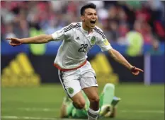  ??  ?? Mexico's Hirving Lozano celebrates after scoring his side's second goal during the Confederat­ions Cup, Group A soccer match between Mexico and Russia, at the Kazan Arena on Saturday in Russia. AP PHOTO