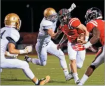  ?? NATE HECKENBERG­ER - FOR DIGITAL FIRST MEDIA ?? Coatesvill­e’s Ricky Ortega helped lead the Red Raiders to a 42-14 victory over Downingtow­n West on Friday.