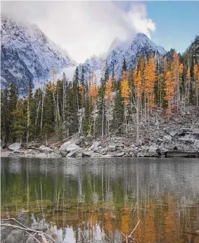  ?? Michael Naiman/Seattle Post-Intelligen­cer file photo ?? A reflection of Colchuch Peak in Colchuck Lake near The Enchantmen­t Lakes wilderness in Washington. A 53-year-old Connecticu­t man was among three climbers killed Sunday in an avalanche in central Washington, officials said.