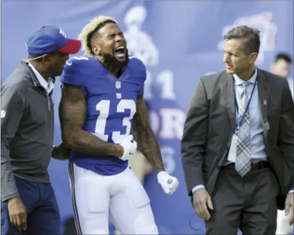  ?? THE ASSOCIATED PRESS ?? Giants wide receiver Odell Beckham (13) reacts as he is helped off the field after being injured on a play Sunday against the Ravens.