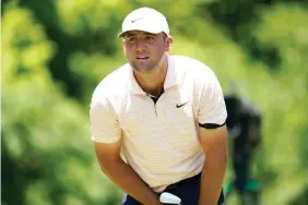  ?? AP Photo/LM Otero ?? ■ Scottie Scheffler watch his tee shot off the eighth hole Friday during the second round of the Charles Schwab Challenge golf tournament at the Colonial Country Club in Fort Worth, Texas.