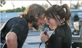  ?? NEAL PRESTON/ WARNER BROS. ?? Bradley Cooper, left, and Lady Gaga star the latest reboot of the film A Star is Born.