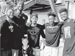  ?? COURTESY OF IBRAHIM FAMOUKE DOUMBIA ?? Magic rookie Mohamed Bamba has developed close ties to UCF thanks to Ibrahim Famouke Doumbia, a Knight he considers to be a brother. UCF players Chad Brown, left, and Tacko Fall, second from left, join NBA prospect Braian Angola-Rodas, Doumbia and Bamba with a UCF fan.