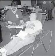  ?? Submitted photo ?? Presbyteri­an church member Virgil Halgrim gives blood on Jan. 15 at the church-sponsored blood drive for the Community Blood Center of the Ozarks.