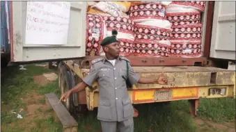  ??  ?? Outgoing Customs Area Controller (CAC), Federal Operations Unit (FOU), Zone C, Owerri, Imo State, Comptrolle­r Mohammed Uba displaying some of the seizures made by the unit in the month of April in Benin City, Edo State… recently