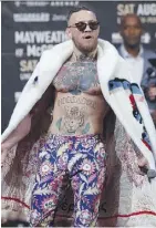  ?? MIKE STOBE/GETTY IMAGES ?? Conor McGregor had former champ Paulie Malignaggi as a sparring partner, but their sessions lasted only days.