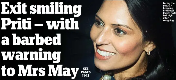  ??  ?? Facing the music: A beaming Priti Patel leaves No 10 last night after resigning