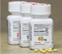  ?? GEORGE FREY/REUTERS ?? Bottles of prescripti­on painkiller OxyContin pills, made by Purdue Pharma sit on a counter at a local pharmacy in Provo, Utah, in 2017.