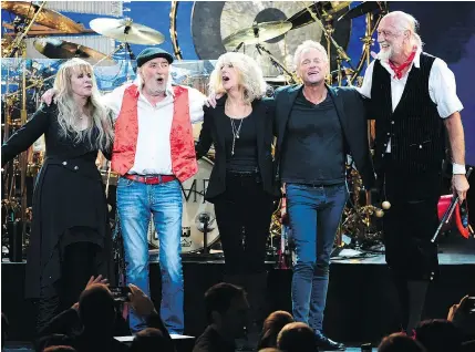  ?? — AP FILES ?? The way they were: Fleetwood Mac members Stevie Nicks, left, John McVie, Christine McVie, Lindsey Buckingham and Mick Fleetwood take a bow after a show. Buckingham has left the band.