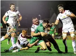  ??  ?? POWER: Tiernan O’Halloran avoids the Ulster tackles to get the third try for Connacht