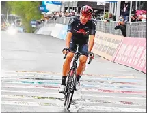  ??  ?? Filippo Ganna crosses the finish line to win the fifth stage of the Giro D’Italia, tour of Italy cycling race, from Mileto to Camigliate­llo Silano, Italy on Oct 7. (AP)