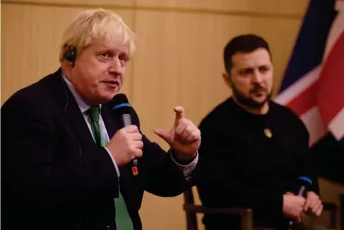  ?? (Reuters) ?? The former PM and Ukrainian president inKy iv –‘ It would only take a minute ,’ Vladimir Put in told Boris Johnson before the invasion