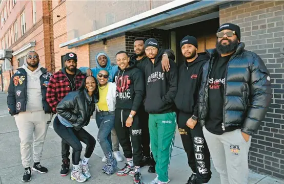  ?? KIM HAIRSTON/BALTIMORE SUN ?? A group of Black entreprene­urs who have fashion brand shops on 25th Street and, wearing white jacket, Brittany“B. Will”Williams, stand outside The Voxel.