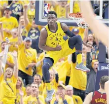  ??  ?? The Pacers’ Victor Oladipo celebrates after making a dunk.