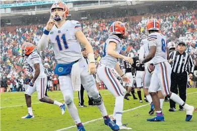  ?? STREETER LECKA/GETTY ?? Florida starting quarterbac­k Kyle Trask (11) can trace his football roots back to his grandfathe­r, Oilers defensive tackle Orville Trask.