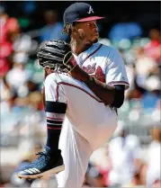  ?? CURTIS COMPTON / CCOMPTON@AJC.COM ?? In his fourth start, Touki Toussaint picked up the win by holding the Cardinals to five hits in 5⅔ innings, then four relievers finished.