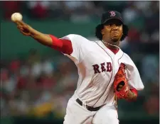  ?? CHARLES KRUPA, FILE — THE ASSOCIATED PRESS ?? In this June 25, 2004 file photo, Boston Red Sox starting pitcher Pedro Martinez delivers during the first inning of a Major League baseball game against the Philadelph­ia Phillies at Fenway Park in Boston. Martinez is among among 17 first-time candidates on the 2015 Baseball Hall of Fame ballot.