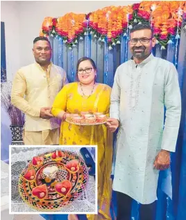  ?? Photos / supplied ?? Amar and Anji with their friend Pranil Prasad at the Diwali celebratio­n. The lighting of diyas (inset) is part of the Diwali celebratio­ns.