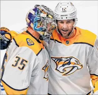  ?? AP PHOTO ?? Nashville Predators’ Mike Fisher and goaltender Pekka Rinne celebrate a 5-0 series-winning victory over the Colorado Avalanche Sunday in Denver.