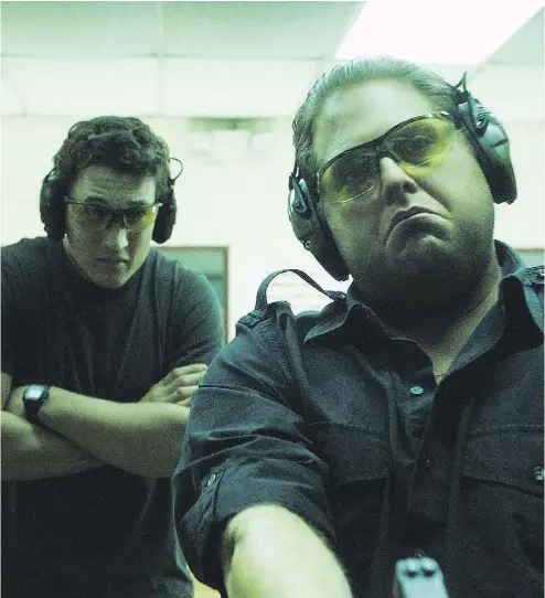  ?? WARNER BROS. PICTURES / THE ASSOCIATED PRESS ?? Miles Teller, left, and Jonah Hill star as a couple of bros who sell their souls for quick riches in War Dogs.
