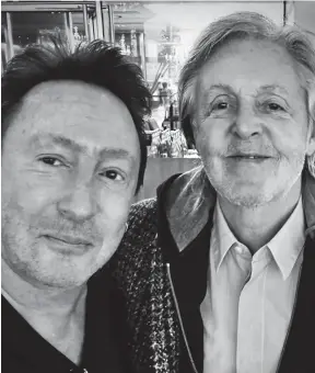  ?? ?? Come together: Julian Lennon and Paul McCartney at Heathrow