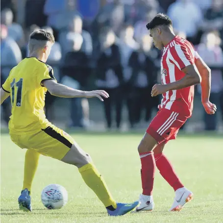  ??  ?? Sunderland new boy Reece James plays a pass in Tuesday night’s opening pre-season friendly at Darlington.