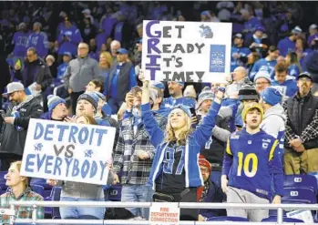  ?? DUANE BURLESON AP ?? Lions fans cheer before last week’s win against the Rams, Detroit’s first playoff victory in 31 years.