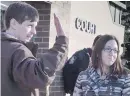  ??  ?? Edouard Maurice and his wife, Jessica, acknowledg­e supporters outside court in Okotoks, Alta., in March.