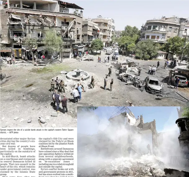  ??  ?? Syrians inspect the site of a suicide bomb attack in the capital’s eastern Tahrir Square district. — AFP photo People inspect the damage at a blast site in the Baytara traffic circle near the Old City of Damascus. — Reuters