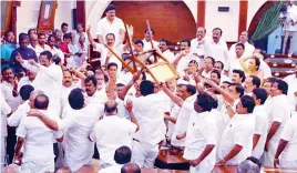  ??  ?? The Tamil Nadu Assembly on Saturday witnessed stormy scenes during which chairs toppled and sheets of papers were torn and hurled around.