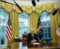  ?? EVAN VUCCI — THE ASSOCIATED PRESS ?? In this photo, President Donald Trump listens during a phone call with Mexican President Enrique Pena Nieto about a trade agreement between the United States and Mexico, in the Oval Office of the White House. Trump is making trade policy the connective tissue that ties together his “America First” foreign policy and his political strategy for the 2020 presidenti­al election.