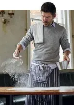  ??  ?? ↖ Flour power: Russell Norman preps his work surface for rolling out the pizza base