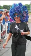  ??  ?? Arlene Hogan of Clifton Park sports a blue headpiece during the 27th annual Hat Contest on Sunday at Saratoga Race Course.